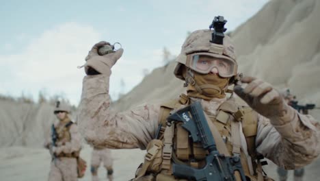 Soldier-Throwing-a-Granade-during-Combat-in-the-Desert.-Slow-Motion.