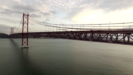 Cars,-trains,-bus-on-25-April-bridge-in-Lisbon-aerial-view