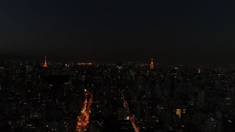 Flying-Over-Sao-Paulo-City-at-night,-Brazil