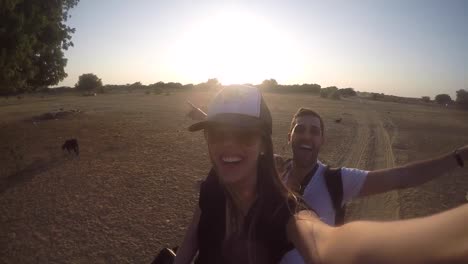 Couple-taking-a-selfie-in-a-camel-riding-in-desert