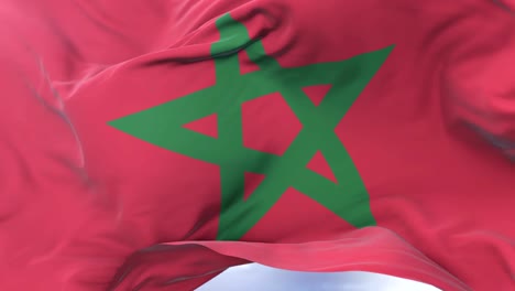 Morocco-flag-waving-at-wind-in-slow-in-blue-sky,-loop