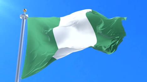 Bandera-de-Nigeria-ondeando-al-viento-en-lento-en-cielo-azul,-lazo