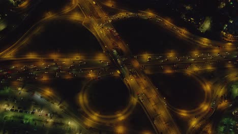 Aerial-view-of-freeway-interchange-at-night