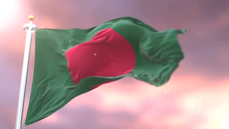 Bangladesh-flag-waving-at-wind-in-slow-at-sunset,-loop