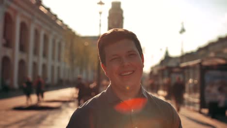 Attractive-Smiling-Male-Outdoors-in-Urban-Environment.-Street-sunset