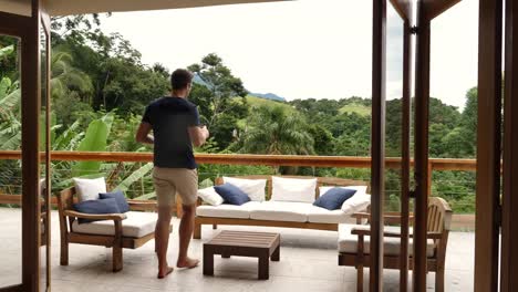 Guy-relaxing-on-balcony