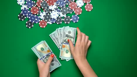Poker-player-counting-money-on-casino-table,-victory,-successful-game,-top-view