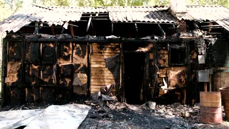 Burned-down-private-wooden-house.