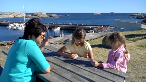 Two-little-girls-have-fun-with-their-grandmother