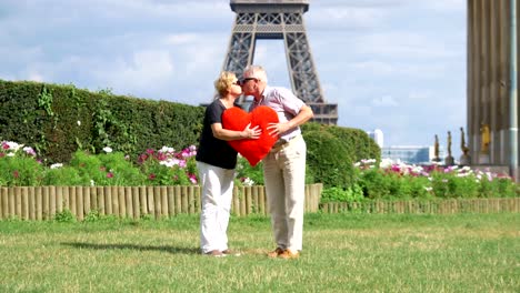 Senior-couple-kissing-in-front-of-Eiffel-tower-on-valentines-day-in-4k-slow-motion-60fps
