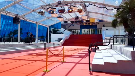 Red-carpet-on-stairs-in-entrance-of-Palais-des-Festivals-et-des-Congres,-Cannes