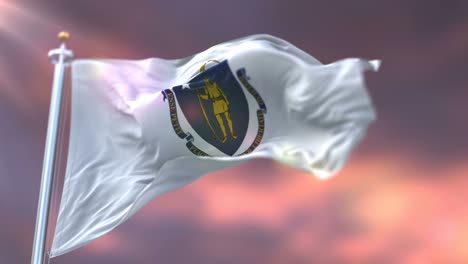 Flag-of-american-state-of-Massachusetts-at-sunset,-United-States---loop