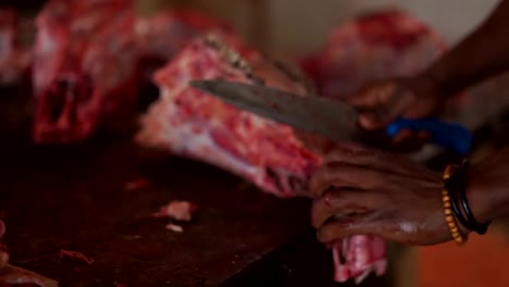 Butcher-chopping-cow-head-meat-at-meat-market