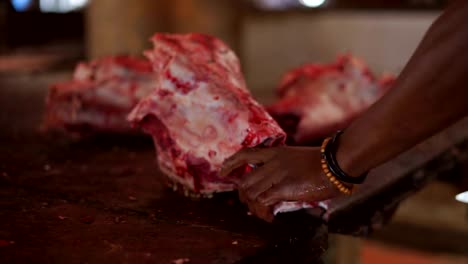 Butcher-chopping-cow-head-meat-at-meat-market