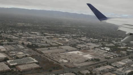 Aerial-view-of-San-Jose-Suburbs-out-of-plane-window-4k