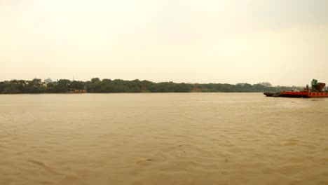 barge-floats-on-river-Hoogli-trees-and-some-buildings-on-bank