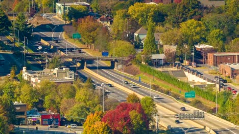 Traffic-Passing-Downtown-Asheville,-NC-on-I240-During-the-Fall