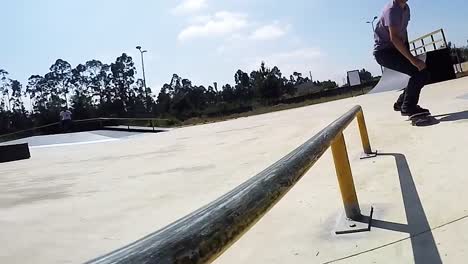 Skateboarder-grinding-down-rail