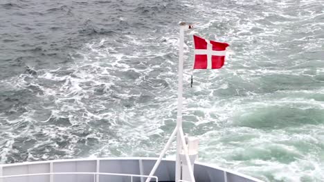 Danish-flag-fluttering-in-the-wind-on-the-ship