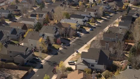 AERIAL,-CLOSE-UP:-Suburban-village-with-expensive-row-houses-on-sunny-fall-day