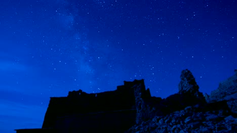 Night-star-time-lapse-of-milky-way-over-Ait-Ben-Haddou-Castle-in-Morocco,-exterior-in-movie-Game-of-Thrones