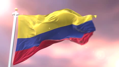 Bandera-de-Colombia-ondeando-en-el-viento-lento-en-puesta-de-sol,-lazo