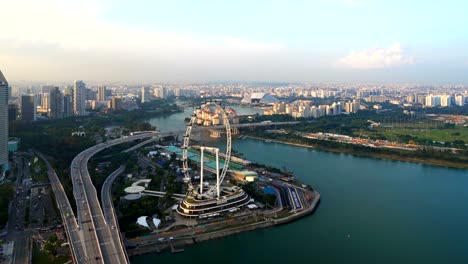 Singapore-Flyer,-the-ferris-wheel,-and-skyscraper-buildings-in-financial-district,-downtown-Singapore-City