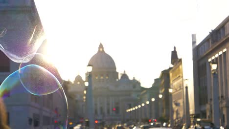 CLOSE-UP:-Big-soap-bubble-flies-by-unrecognizable-tourist-watching-the-sunset.