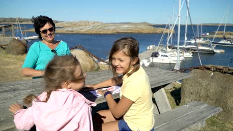 Two-little-girls-have-fun-with-their-grandmother