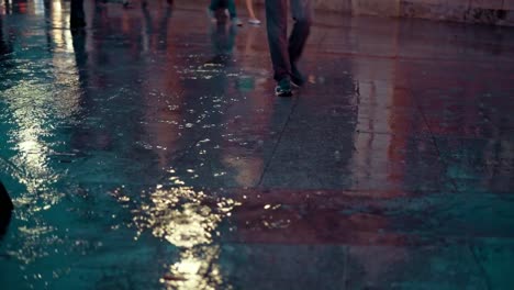 close-up-people-walking-in-the-city-street-during-the-heavy-rain