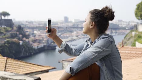 Portrait-girl-enjoying-beautiful-cityscape-on-high-viewpoint