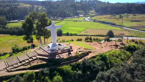 Beautiful-Aerial-shot-of-White-Christ-and-forrest.-Latin-America.