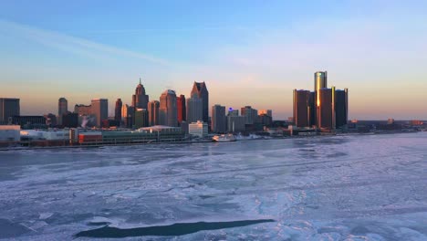 Frozen-Detroit-river-Renaissance-center-aerial-view-Winter-at-Sunset