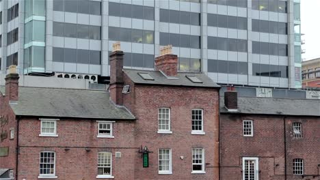 Tilt-up-Modern-High-Rise-Building-from-Traditional-Pub-on-Canal