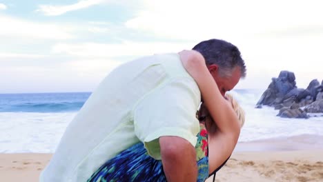 Close-up-of-an-older-couple-dancing-on-the-beach