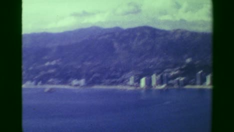 1978:-Acapulco-harbor-bay-hotel-beach-resort-area-high-perspective-view.