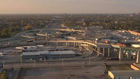 AERIAL-Traffic-on-busy-interchange-highway-full-of-personal-cars-and-semi-trucks