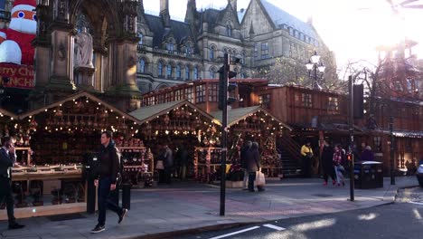 MANCHESTER,UK---DECEMBER-16,-2016.-Shot-of-shoppers-at-the-Christmas-market-in-front-of-the-Manchester-Town-Hall-on-Albert-Square.-December-16,-2016