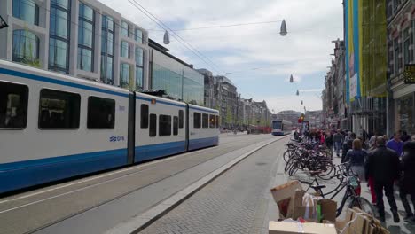 Two-trams-transport-moving-on-the-streets-in-Amsterdam
