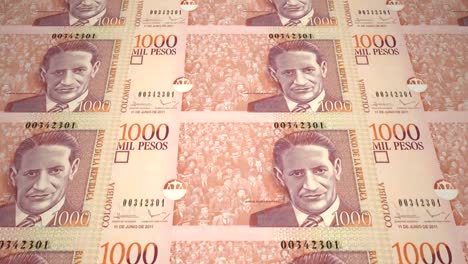 Banknotes-of-one-thousand-colombian-pesos-of-Colombia,-cash-money,-loop