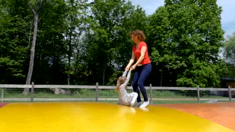 Mother-and-Daughter-Playing-on-a-Jumping-Pillow-2