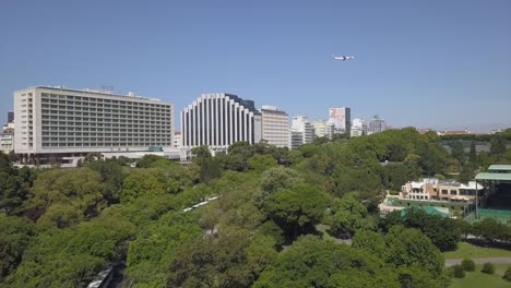 portugal-sunny-day-lisbon-cityscape-plain-traffic-park-panorama-4k