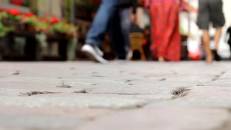 Cobbled-street.-Crowd-people--on-the-background-walking-on-the-street