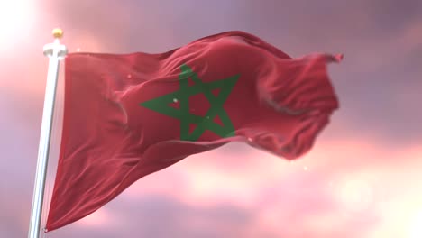 Flag-of-Morocco-waving-at-wind-in-slow-at-sunset,-loop