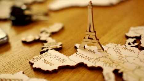 Map-of-Europe,-France,-wooden-model.-Eiffel-Tower.-Tourist-attractions,-travel-planning