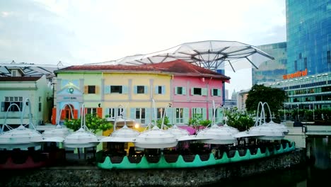 Aerial-video-of-Clarke-Quay-with-city-skyline-at-background