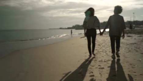 Close-up-shot-of-two-women-holding-hands-together.