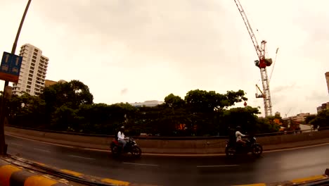 streets-of-Mumbai-view-on-many-storied-houses-mouving-roadway