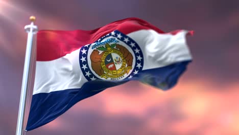Flag-of-Missouri-state-at-sunset,-region-of-the-United-States---loop