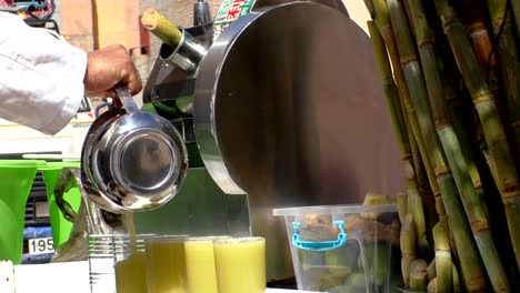 Street-seller-pouring-bamboo-juice